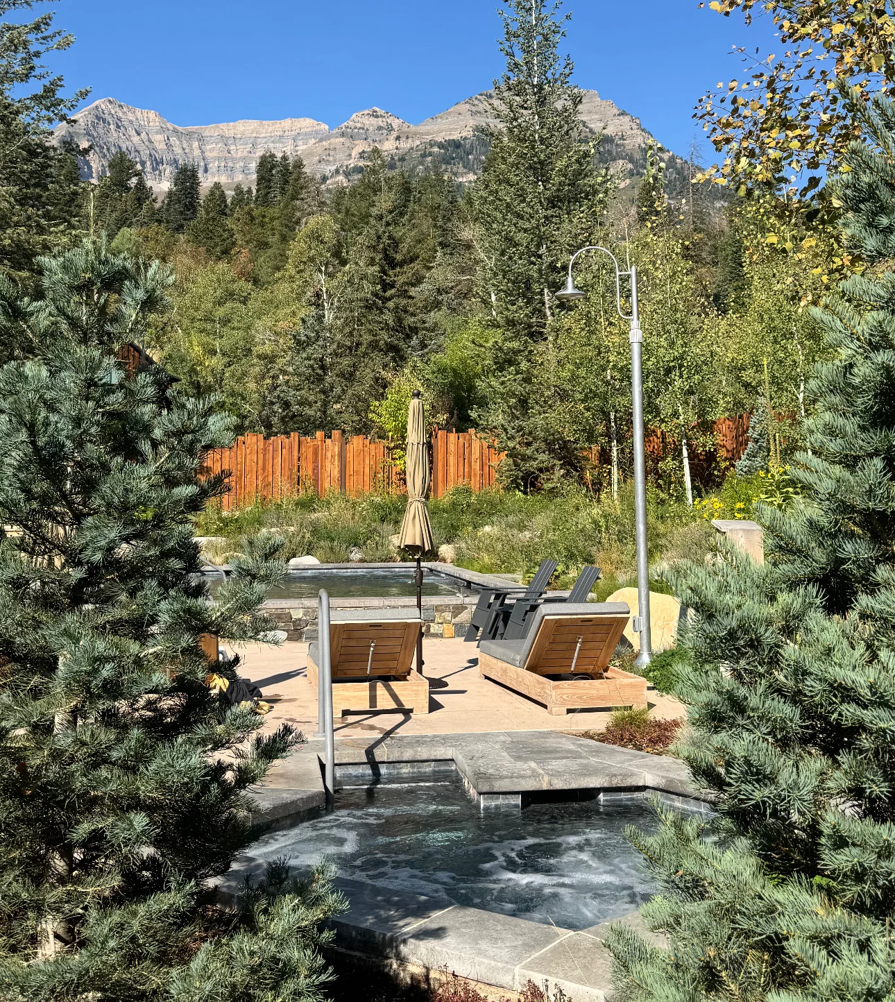 The Springs pool and hot tubs at Sundance Resort with Mount Timpanogos behind